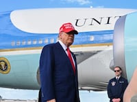 US President Donald Trump speaks to reporters after landing at the Palm Beach International Airport in West Palm Beach, Florida on February 16, 2025 after attending the Daytona 500 car race earlier in the day. US President Donald Trump said Sunday he could meet "very soon" with Vladimir Putin, adding he believes his Russian counterpart genuinely wants to stop fighting in Ukraine. (Photo by ROBERTO SCHMIDT / AFP via Getty Images)