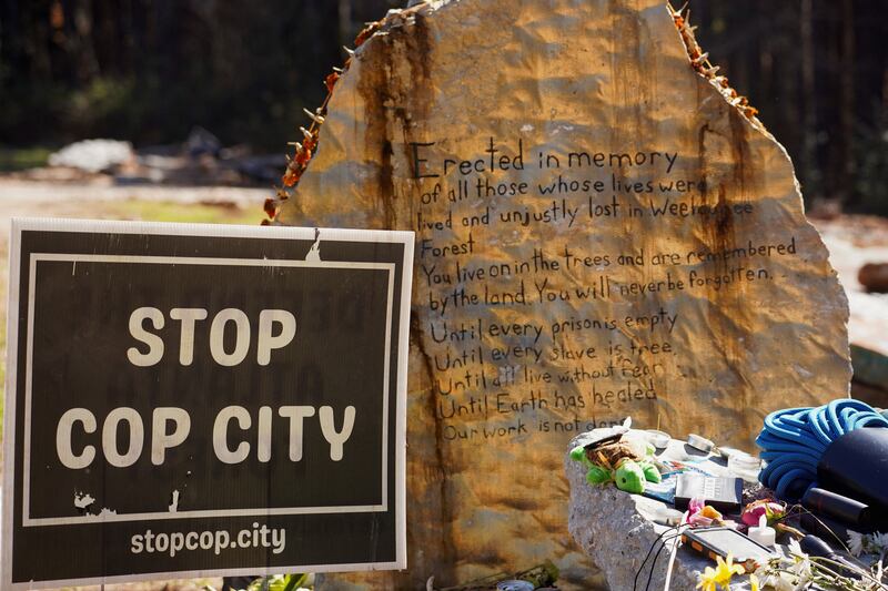 A memorial to activist Manuel Teran sits at the trail head near the “Cop City” construction site.