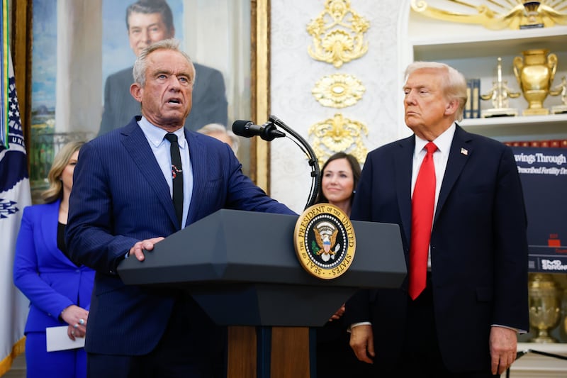 WASHINGTON, DC - OCTOBER 16: Secretary of Health and Human Services Robert F. Kennedy Jr. delivers remarks as U.S. President Donald Trump looks on during an event in the Oval Office of the White House on October 16, 2025 in Washington, DC. U.S. President Donald Trump outlined plans during the event to expand vitro fertilization (IVF) access by encouraging workplace benefits to include access to IVF and infertility coverage. (Photo by Kevin Dietsch/Getty Images)