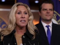 Rep. Marjorie Taylor Greene (R-GA) speaks as former Rep. Matt Gaetz (R-FL) listens during a news conference at the U.S. Capitol on November 17, 2022 in Washington, DC.