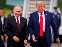 President Donald Trump greets Russian President Vladimir Putin as he arrives at Joint Base Elmendorf-Richardson on August 15, 2025 in Anchorage, Alaska.