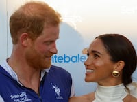 Britain's Prince Harry and Meghan, Duchess of Sussex, look at each other as they attend the Royal Salute Polo Challenge to benefit Sentebale, in Wellington, Florida, U.S., April 12, 2024.