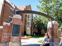 Gainesville, University of Florida, campus entrance with students.