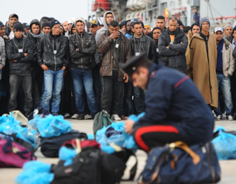 articles/2011/03/21/italys-libyan-refugee-camp-horror/nadeau-lampedusa_168133_fvrbzv