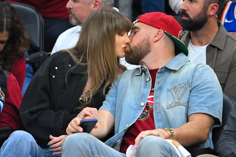 CLEVELAND, OHIO - MAY 23: (L-R) Singer Taylor Swift and Travis Kelce of the Kansas City Chiefs kiss during Game Three between the New York Knicks and the Cleveland Cavaliers in the NBA Eastern Conference Finals at Rocket Arena on May 23, 2026 in Cleveland, Ohio. NOTE TO USER: User expressly acknowledges and agrees that, by downloading and or using this photograph, User is consenting to the terms and conditions of the Getty Images License Agreement. (Photo by Jason Miller/Getty Images)