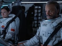 A still of Masha Mashkova and Joel Kinnaman in a space ship in 'For All of Mankind'