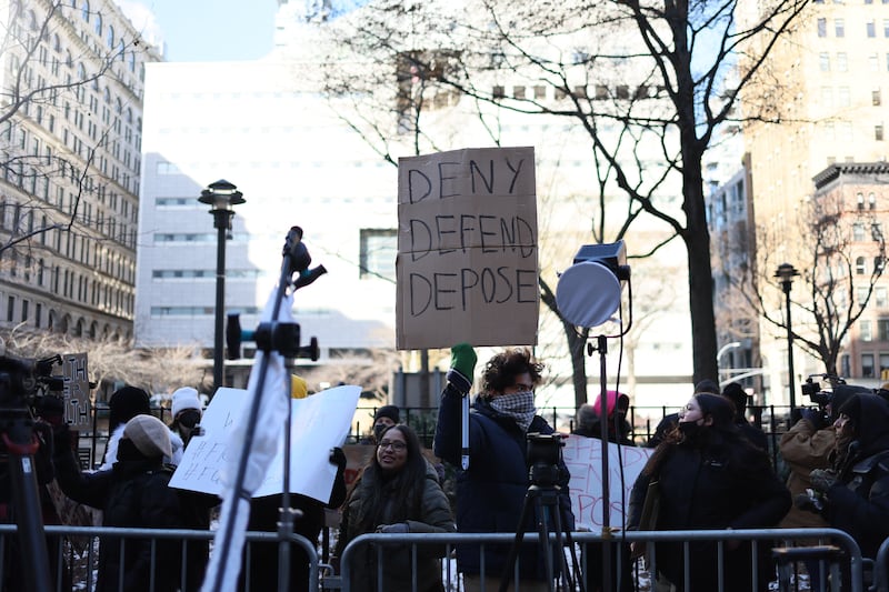 People demonstrate against the healthcare industry outside Federal Criminal Court in New York City during an arraignment hearing for Luigi Mangione on December 23, 2024.