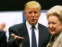 Donald Trump gestures as he stands next to his sister Maryanne Trump Barry.