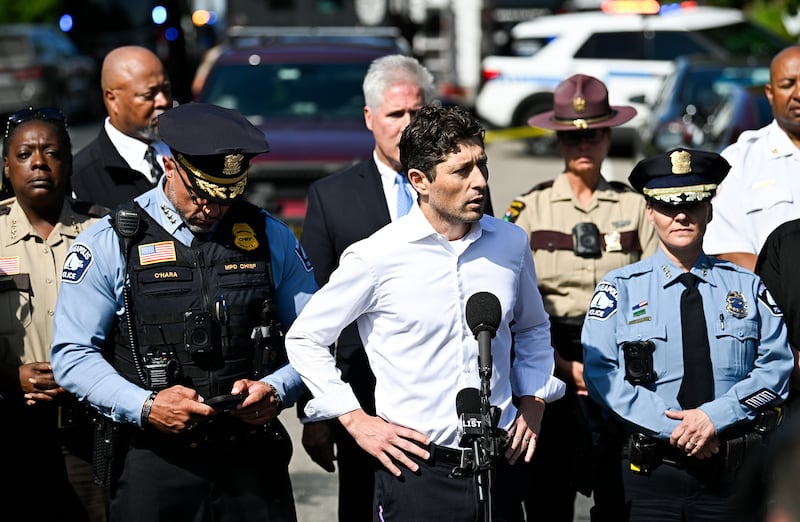Minneapolis Mayor Jacob Frey (C) speaks to the media following a mass shooting at Annunciation Catholic Church on Aug. 27, 2025 in Minneapolis, Minnesota. According to Minneapolis Police, a gunman fired through the windows of the church at worshippers sitting in pews during a Catholic school Mass, killing two children and injuring at least 17 others. The gunman reportedly died at the scene from a self-inflicted gunshot wound.
