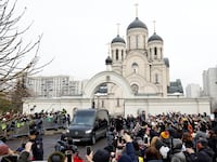 A hearse, which reportedly transports a coffin with the body of Russian opposition politician Alexei Navalny, is parked outside the Soothe My Sorrows church before a funeral service and farewell ceremony in Moscow, Russia, March 1, 2024.