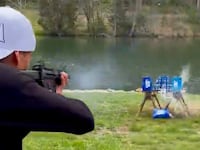 Kid Rock shoots cases of Bud Light.