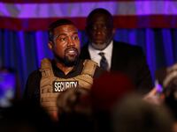 Kanye West speaking to a crowd.