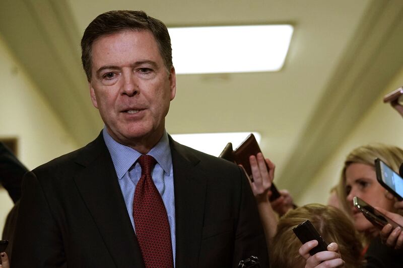 James Comey speaks to members of the media at the Rayburn House Office Building after testifying to the House Judiciary and Oversight and Government Reform committees on Capitol Hill December 07, 2018 in Washington, DC.