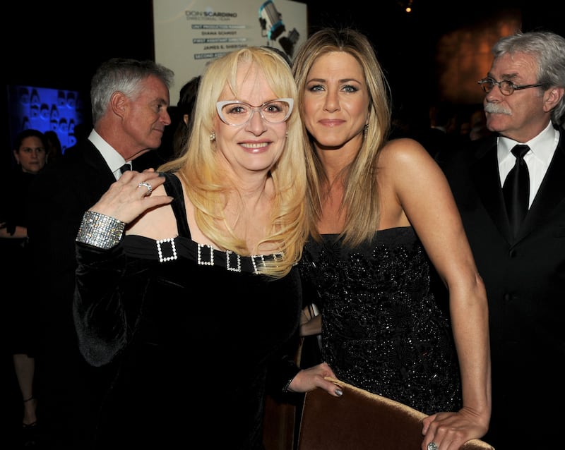 Director Penelope Spheeris and actress-director Jennifer Aniston attend the 64th Annual Directors Guild Of America Awards cocktail reception held at the Grand Ballroom at Hollywood & Highland on January 28, 2012 in Hollywood, California.