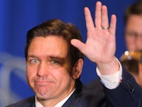 Florida Gov. Ron DeSantis arrives to speak at the 2023 NHGOP Amos Tuck Dinner in Manchester, New Hampshire, April 14, 2023.
