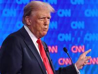 Donald Trump points while speaking during Thursday’s debate.