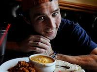 Tim "Eater X" Janus poses for a portrait with his lunch, the Green Chili Plate, at City Grille in Denver, CO, August 27, 2010. Janus was talking with the Denver Post about the eating contest he will participate in on Saturday, hosted by the Isle of Capri Casinos Hotel and Lady Luck Casino in Black Hawk, CO. Janus currently hold 7 world records in various eating contests.