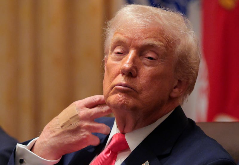 WASHINGTON, DC - DECEMBER 02: U.S. President Donald Trump looks on during a meeting of his Cabinet in the Cabinet Room of the White House on December 02, 2025 in Washington, DC. A bipartisan Congressional investigation has begun regarding Secretary of War Pete Hegseth's role in ordering U.S. military strikes on small boats in the waters off Venezuela that have killed scores of people, which Hegseth said are intended "to stop lethal drugs, destroy narco-boats and kill the narco-terrorists who are poisoning the American people.” (Photo by Chip Somodevilla/Getty Images)