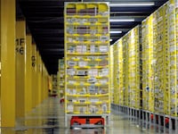 A photo of robots transporting goods at an Amazon warehouse