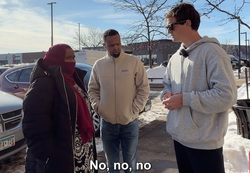 Shirley speaking to people outside a Minnesota day-care center.