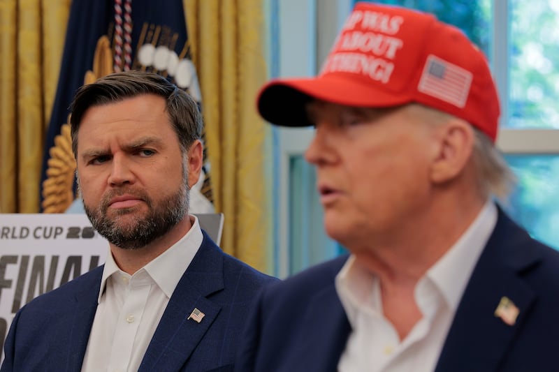 WASHINGTON, DC - AUGUST 22: Vice President JD Vance looks at U.S. President Donald Trump as he talks in the Oval Office August 22, 2025 in Washington, DC. Trump announced the FIFA World Cup 2026 draw will take place at The Kennedy Center. (Photo by Chip Somodevilla/Getty Images)