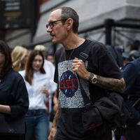 Terry Richardson walks into a Fashion Week in 2017 wearing glasses.