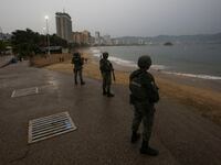 Soldiers keep watch at a beach as Hurricane Otis barrels towards Acapulco, Mexico, October 24, 2023.