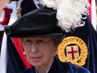 Princess Anne, arrives for the Order of the Garter service at St George's Chapel sporting a chic metallic lip.