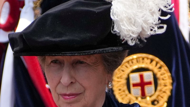 Princess Anne, arrives for the Order of the Garter service at St George's Chapel sporting a chic metallic lip.