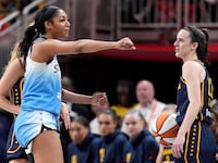 Angel Reese of the Chicago Sky reacts after fouling Caitlin Clark of the Indiana Fever.