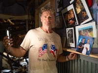 Actor John Schneider, known for his role as Bo Duke in \"The Dukes of Hazzard\" television series, stands inside his studio that was damaged by Hurricane Ida on September 2, 2021 in Holden, Louisiana