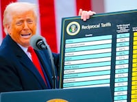 President Donald Trump holds up a chart while speaking during a “Make America Wealthy Again” trade announcement event in the Rose Garden at the White House on April 2, 2025 in Washington, DC.