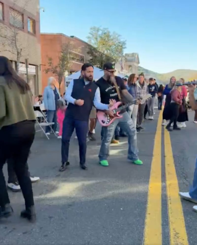 Lawler played air guitar for a few moments at Sunday's street fair during a Sublime song.