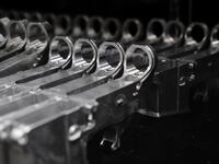 Aluminum 80% lower receivers for AR-15 rifles are displayed for sale at Firearms Unknown, a gun store in Oceanside, California.