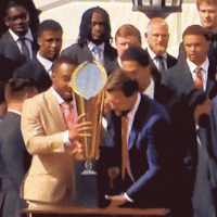 Vice President, JD Vance, breaks the CFP National Championship Trophy at a reception at the white house