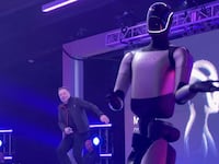 Elon Musk does his cringe dance moves after the announcement of his $1T Tesla deal.