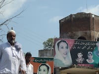 articles/2013/08/21/pakistan-s-murder-mystery/130820-Haqqani-Musharraf-tease_pvequb