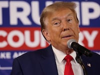Donald Trump rallies with supporters at a “commit to caucus” event at a Whiskey bar in Ankeny, Iowa, Dec. 2, 2023.
