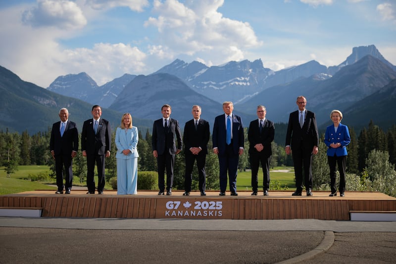 (L-R) European Union Council President Antonio Costa, Japanese Prime Minister Shigeru Ishiba, Italian Prime Minister Giorgia Meloni, French President Emmanuel Macron, Canadian Prime Minister Mark Carney, U.S. President Donald Trump, British Prime Minister Keir Starmer, German Chancellor Friedrich Merz and European Union Commission President Ursula von der Leyen pose for a group photo in front of the Canadian Rockies at the Kananaskis Country Golf Course during the G7 Leaders' Summit on June 16, 2025 in Kananaskis, Alberta. Canada