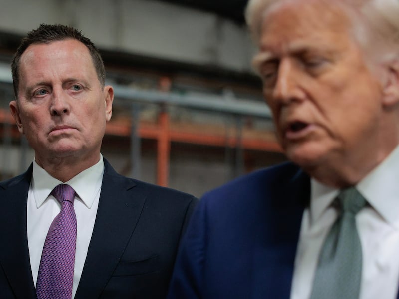U.S. President Donald Trump speaks to the media alongside Richard Grenell.