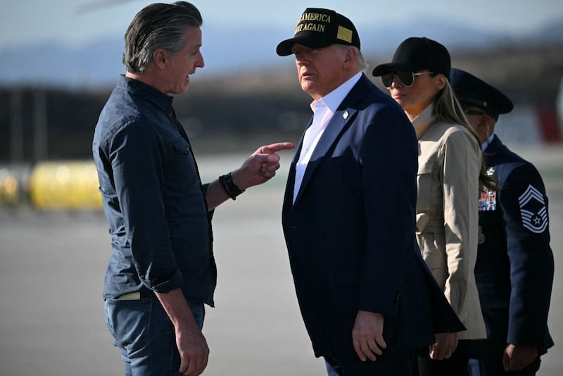 US President Donald Trump and First Lady Melania Trump are greeted by California Governor Gavin Newsom upon arrival at Los Angeles International Airport in Los Angeles, California, on January 24, 2025, to visit the region devastated by the Palisades and Eaton fires. (Photo by Mandel NGAN / AFP) (Photo by MANDEL NGAN/AFP via Getty Images)