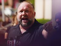 InfoWars founder Alex Jones speaks to the media outside Waterbury Superior Court during his trial on September 21, 2022 in Waterbury, Connecticut