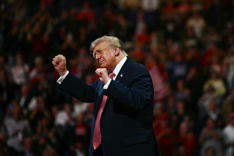 Trump dances during a campaign rally at the Heartland Credit Union Arena in Park City, a Wichita suburb, on October 19, 2026.