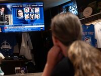 The trial of Republican presidential candidate former President Donald Trump is broadcast on the television at the Billy Goat Tavern in Chicago.