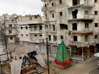 articles/2014/12/25/in-one-corner-of-syria-christmas-spirit-somehow-manages-to-survive/141224-schwartzstein-syria-christmas-tease_gai0zq
