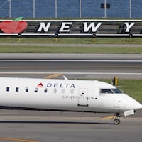 A Delta Airlines jet moves along the runway at Laguardia AIrport on November 10, 2022 in the Queens borough of New York City. The airline industry has rebounded this year and is looking forward to a busy holiday season. (Photo by Bruce Bennett/Getty Images)