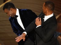 Will Smith slaps US actor Chris Rock onstage during the 94th Oscars at the Dolby Theatre in Hollywood, California on March 27, 2022.