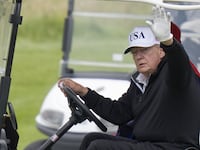 US President Donald Trump waves while in a golf cart at his Trump Turnberry golf course in South Ayrshire, during his five-day private trip to the country. Picture date: Sunday July 27, 2025. (Photo by Jane Barlow/PA Images via Getty Images)