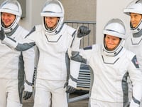 NASA astronauts commander Anne McClain and pilot Nichole Ayers, alongside mission specialists, JAXA (Japan Aerospace Exploration Agency) astronaut Takuya Onishi and Roscosmos cosmonaut Kirill Peskov exit the Neil A. Armstrong Operations and Checkout building at NASA Kennedy ahead of launch on March 14, 2025 in Cape Canaveral, Florida.
