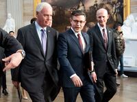 Speaker of the House Mike Johnson walks with colleagues